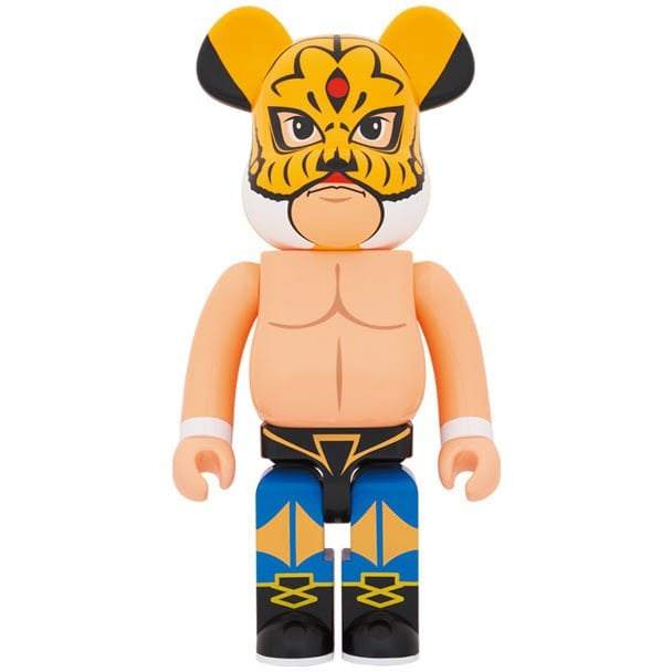 1000% Bearbrick figure wearing Tiger Mask wrestler design with bare chest and blue detailed pants