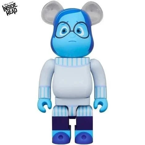 400% Bearbrick Sadness from Inside Out in blue sweater with glasses.